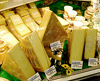Gruyere Cheese Case Wheel slices photo